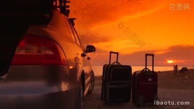 夏季海滩度假目的地两辆手提箱附近的车在夕阳下年轻夫妇的背景